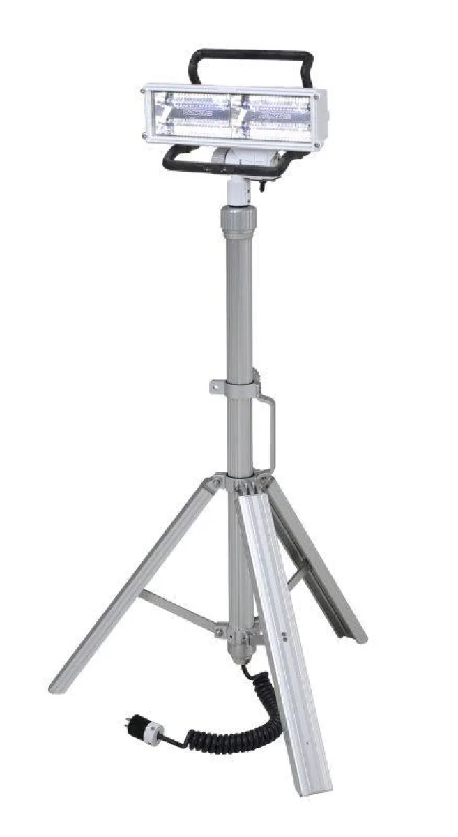 Black coiled extension cord on a telescoping tripod LED light
