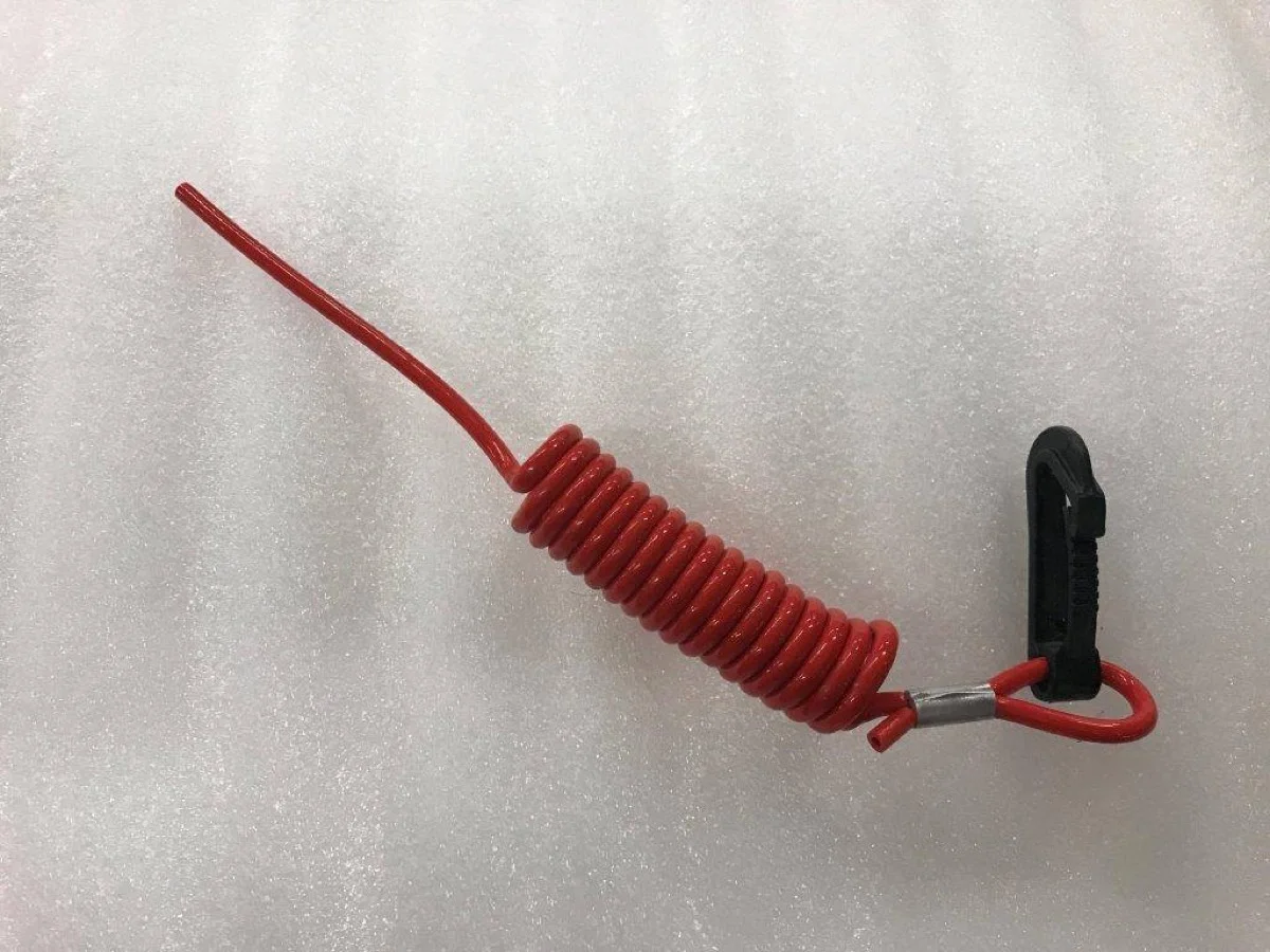 Red coiled safety lanyard cord with molded clip